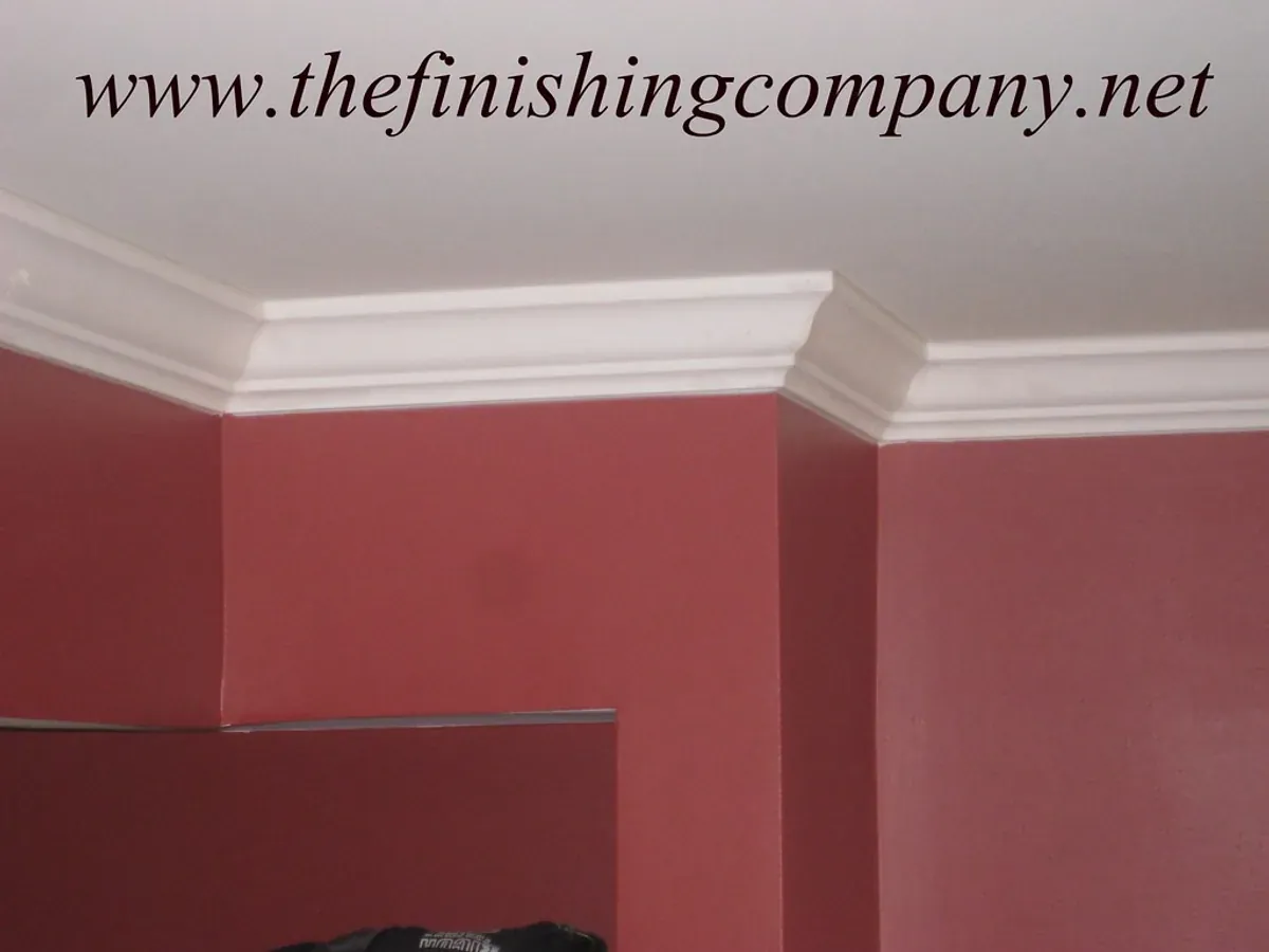 Freshly installed trim and baseboards in a bright room